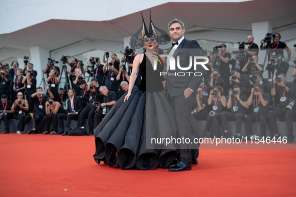 Lady Gaga and Michael Polansky attend the ''Joker: Folie a Deux'' red carpet during the 81st Venice International Film Festival at Sala Gran...