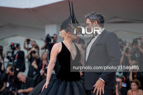 Lady Gaga and Michael Polansky attend the ''Joker: Folie a Deux'' red carpet during the 81st Venice International Film Festival at Sala Gran...