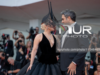 Lady Gaga and Michael Polansky attend the ''Joker: Folie a Deux'' red carpet during the 81st Venice International Film Festival at Sala Gran...