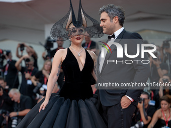 Lady Gaga and Michael Polansky attend the ''Joker: Folie a Deux'' red carpet during the 81st Venice International Film Festival at Sala Gran...