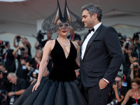 Lady Gaga and Michael Polansky attend the ''Joker: Folie a Deux'' red carpet during the 81st Venice International Film Festival at Sala Gran...