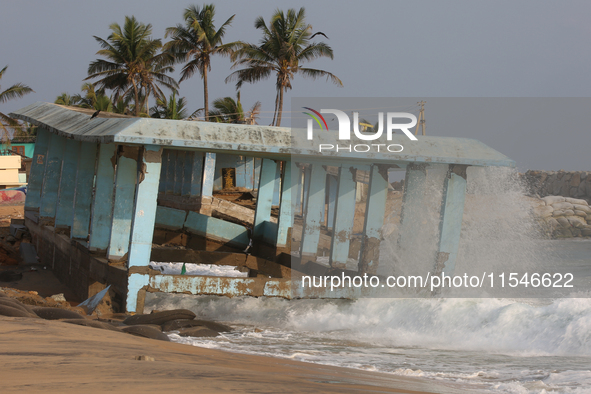 Waves crash against a platform destroyed by the strong ocean tides along Paruthiyoor Beach in Paruthiyoor, Kerala, India, on April 15, 2024....