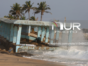 Waves crash against a platform destroyed by the strong ocean tides along Paruthiyoor Beach in Paruthiyoor, Kerala, India, on April 15, 2024....