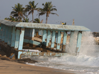 Waves crash against a platform destroyed by the strong ocean tides along Paruthiyoor Beach in Paruthiyoor, Kerala, India, on April 15, 2024....