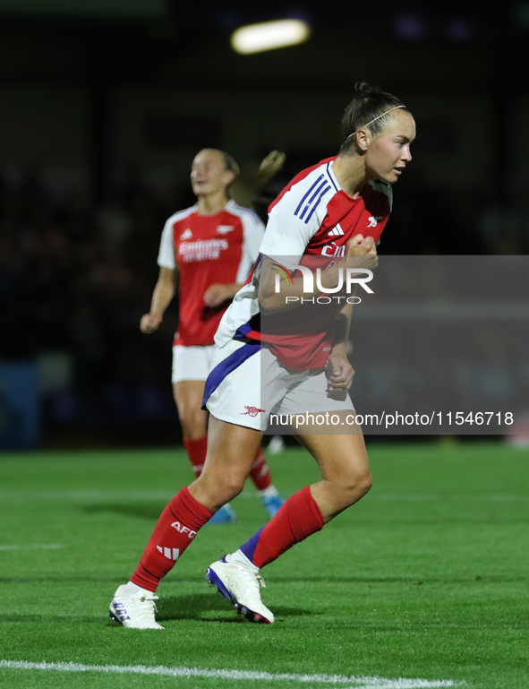 Caitlin Ford celebrates her second goal during the UEFA Women's Champions League Group Three first round semi-final match between Arsenal an...