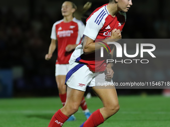 Caitlin Ford celebrates her second goal during the UEFA Women's Champions League Group Three first round semi-final match between Arsenal an...