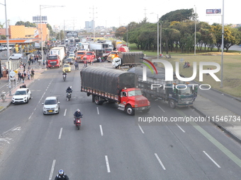 Several tractor-trailers block the northern highway in Bogota, Colombia, on September 4, 2024. Truckers mainly protest against the increase...