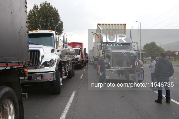 Several tractor-trailers block the northern highway in Bogota, Colombia, on September 4, 2024. Truckers mainly protest against the increase...