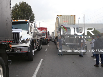 Several tractor-trailers block the northern highway in Bogota, Colombia, on September 4, 2024. Truckers mainly protest against the increase...