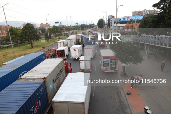 Several tractor-trailers block the northern highway in Bogota, Colombia, on September 4, 2024. Truckers mainly protest against the increase...