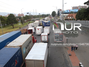 Several tractor-trailers block the northern highway in Bogota, Colombia, on September 4, 2024. Truckers mainly protest against the increase...