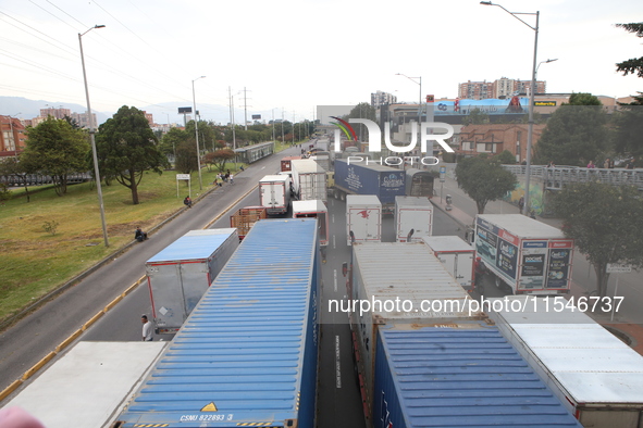 Several tractor-trailers block the northern highway in Bogota, Colombia, on September 4, 2024. Truckers mainly protest against the increase...