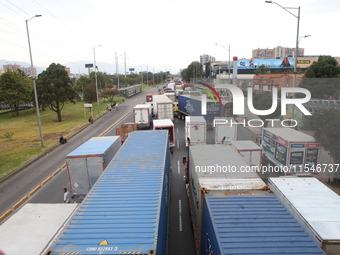 Several tractor-trailers block the northern highway in Bogota, Colombia, on September 4, 2024. Truckers mainly protest against the increase...