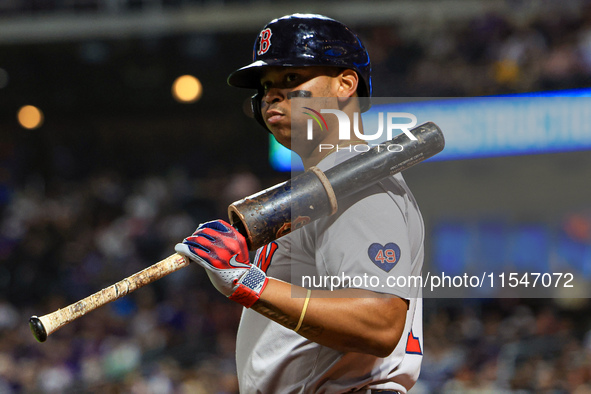 Boston Red Sox Rafael Devers #11 stands on deck during the eighth inning of the baseball game against the New York Mets at Citi Field in Cor...