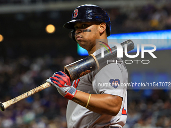 Boston Red Sox Rafael Devers #11 stands on deck during the eighth inning of the baseball game against the New York Mets at Citi Field in Cor...