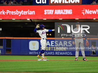 Francisco Lindor #12 of the New York Mets doubles during the fifth inning of the baseball game against the Boston Red Sox at Citi Field in C...