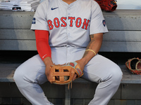 Boston Red Sox Rafael Devers #11 sits in the dugout before the baseball game against the New York Mets at Citi Field in Corona, N.Y., on Sep...