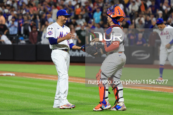 New York Mets relief pitcher Edwin Diaz #39 and catcher Francisco Alvarez #4 celebrate the Mets' 8-3 win in the baseball game against the Bo...