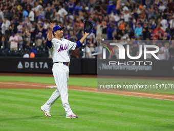 New York Mets relief pitcher Edwin Diaz #39 and catcher Francisco Alvarez #4 celebrate the Mets' 8-3 win in the baseball game against the Bo...