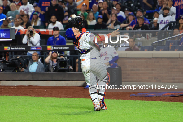 New York Mets catcher Francisco Alvarez #4 makes a catch during the ninth inning of the baseball game against the Boston Red Sox at Citi Fie...