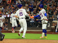 New York Mets Tyrone Taylor #15 scores on a sacrifice fly during the eighth inning of the baseball game against the Boston Red Sox at Citi F...