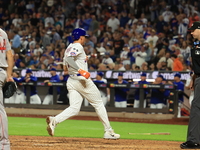 New York Mets Tyrone Taylor #15 scores on a sacrifice fly during the eighth inning of the baseball game against the Boston Red Sox at Citi F...