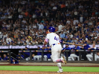 Harrison Bader #44 of the New York Mets hits a sacrifice fly during the ninth inning of the baseball game against the Boston Red Sox at Citi...