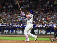 Harrison Bader #44 of the New York Mets hits a sacrifice fly during the ninth inning of the baseball game against the Boston Red Sox at Citi...