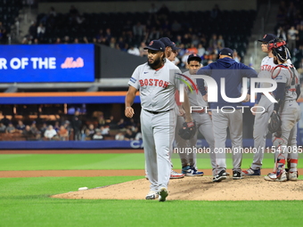 Boston Red Sox pitcher Kenley Jansen #74 is removed from the game by manager Alex Cora #13 during the eighth inning of the baseball game aga...