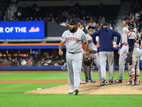 Boston Red Sox pitcher Kenley Jansen #74 is removed from the game by manager Alex Cora #13 during the eighth inning of the baseball game aga...