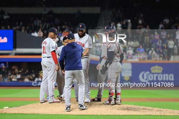 Boston Red Sox pitcher Kenley Jansen #74 is removed from the game by manager Alex Cora #13 during the eighth inning of the baseball game aga...