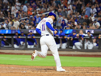 New York Mets' Jose Iglesias #11 scores on a bases-loaded walk during the ninth inning of the baseball game against the Boston Red Sox at Ci...