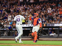 New York Mets relief pitcher Huascar Brazoban #43 celebrates with catcher Francisco Alvarez #4 during the seventh inning of the baseball gam...