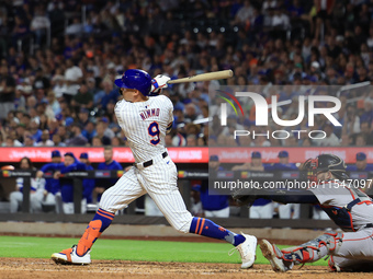 Brandon Nimmo #9 of the New York Mets singles during the fifth inning of the baseball game against the Boston Red Sox at Citi Field in Coron...