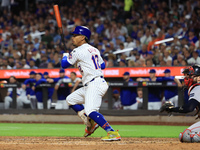 Francisco Lindor #12 of the New York Mets doubles during the fifth inning of the baseball game against the Boston Red Sox at Citi Field in C...