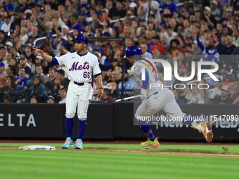 Francisco Lindor #12 of the New York Mets doubles during the fifth inning of the baseball game against the Boston Red Sox at Citi Field in C...