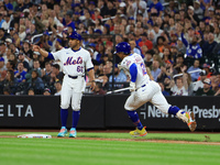 Francisco Lindor #12 of the New York Mets doubles during the fifth inning of the baseball game against the Boston Red Sox at Citi Field in C...