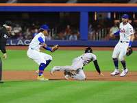 Boston Red Sox Connor Wong #12 is caught in a rundown after attempting to steal second base during the fourth inning of the baseball game ag...