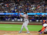 Boston Red Sox Wilyer Abreu #52 hits a sacrifice fly during the third inning of the baseball game against the New York Mets at Citi Field in...