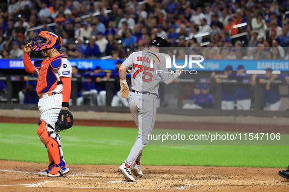 Nick Sogard #75 of the Boston Red Sox scores on a sacrifice fly during the third inning of the baseball game against the New York Mets at Ci...