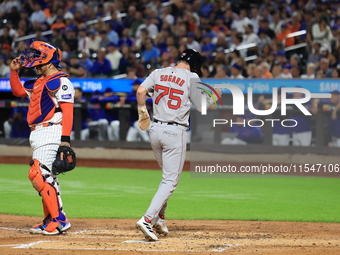 Nick Sogard #75 of the Boston Red Sox scores on a sacrifice fly during the third inning of the baseball game against the New York Mets at Ci...