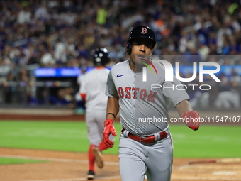 Enmanuel Valdez #47 of the Boston Red Sox scores from second base during the third inning of the baseball game against the New York Mets at...