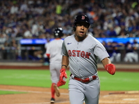 Enmanuel Valdez #47 of the Boston Red Sox scores from second base during the third inning of the baseball game against the New York Mets at...