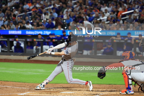 Boston Red Sox Nick Sogard #75 singles during the third inning of the baseball game against the New York Mets at Citi Field in Corona, N.Y.,...