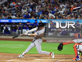 Boston Red Sox Nick Sogard #75 singles during the third inning of the baseball game against the New York Mets at Citi Field in Corona, N.Y.,...