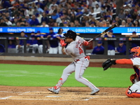 Enmanuel Valdez #47 of the Boston Red Sox singles during the third inning of the baseball game against the New York Mets at Citi Field in Co...