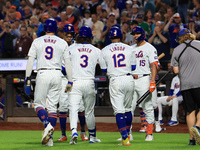 Jesse Winker #3 of the New York Mets is congratulated after hitting a grand slam home run during the first inning of the baseball game again...