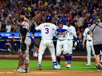 Jesse Winker #3 of the New York Mets is congratulated after hitting a grand slam home run during the first inning of the baseball game again...