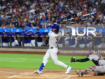 Jesse Winker of the New York Mets, #3, connects for a grand slam home run during the first inning of the baseball game against the Boston Re...