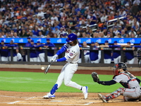 Jesse Winker of the New York Mets, #3, connects for a grand slam home run during the first inning of the baseball game against the Boston Re...